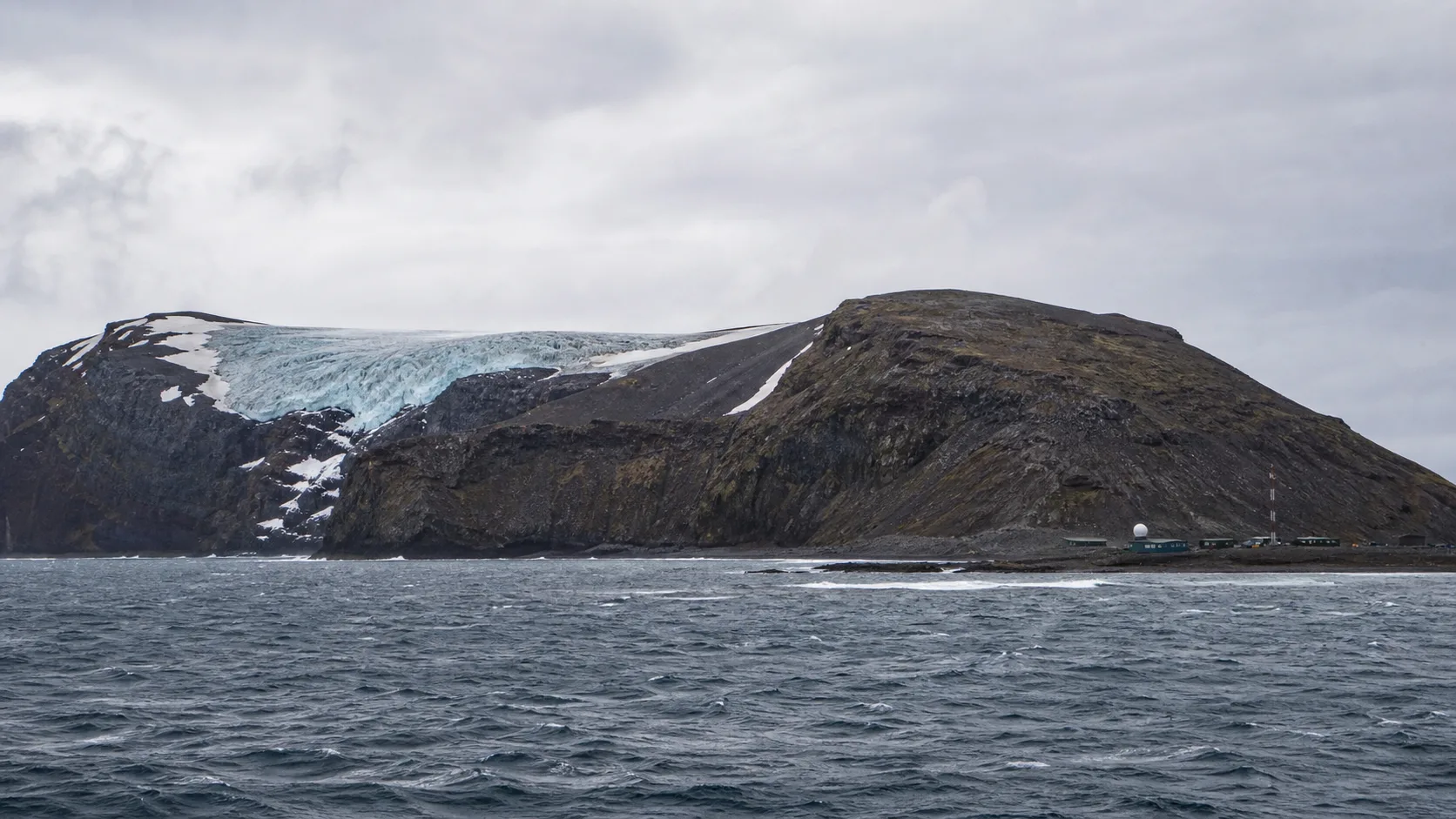 Editorial raster image of Bouvet Island glacier and Southern Ocean for the Bouvet Island pension system