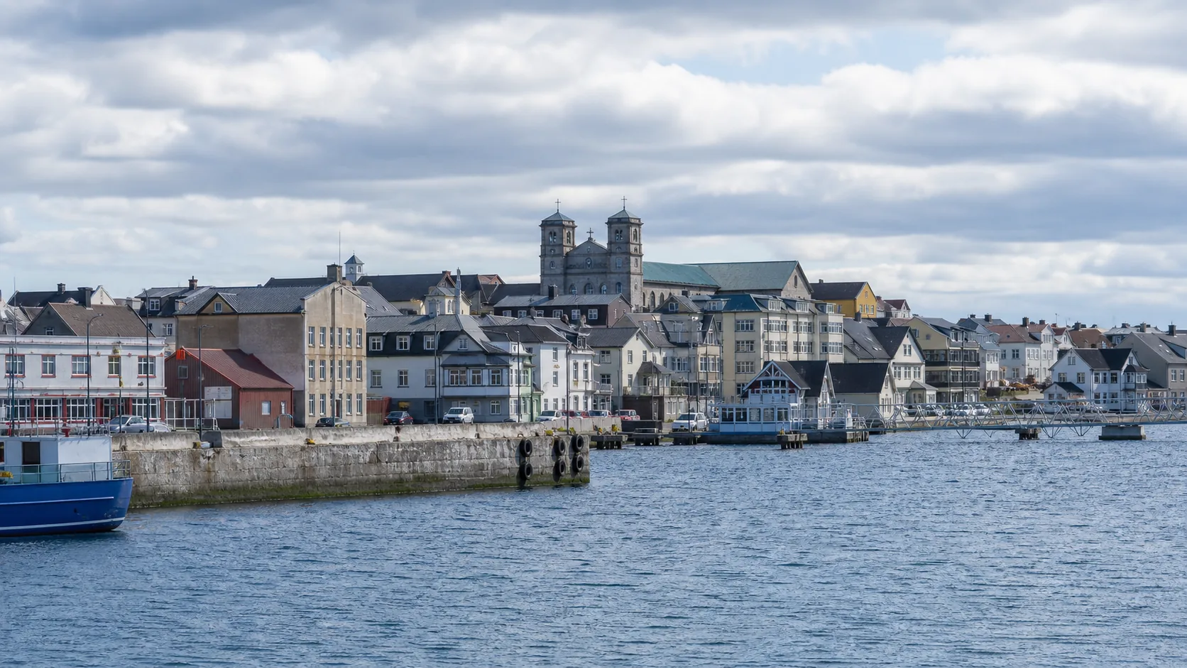 AI-generated editorial image of Saint-Pierre harbor civic buildings for the Saint Pierre and Miquelon pension system